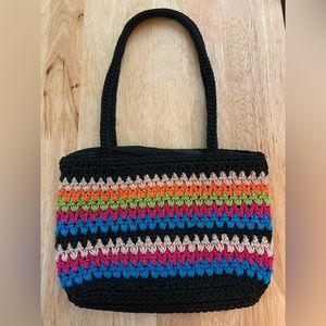 The Sak multi color mini crochet bag with black background